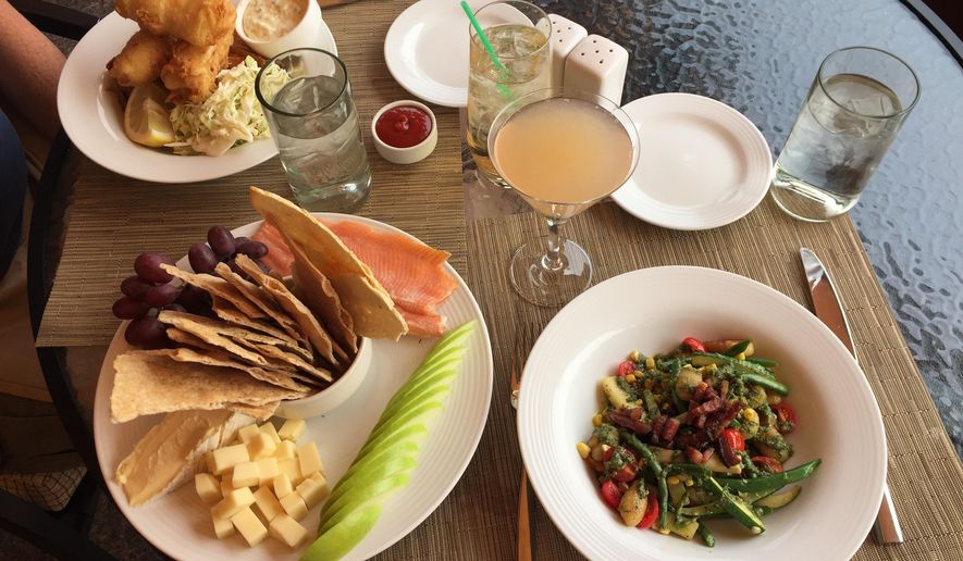 This Sept. 7, 2017 photo shows a scrumptious spread at Gretchen's restaurant at Idaho's famed Sun Valley Resort in Ketchum. Hotel hallways at the resort are lined with black-and-white photos of the rich and famous who've stayed here over the years, including the likes of Ernest Hemingway and Marilyn Monroe. (AP Photo/Beth J. Harpaz)