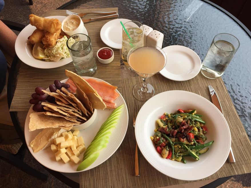 This Sept. 7, 2017 photo shows a scrumptious spread at Gretchen's restaurant at Idaho's famed Sun Valley Resort in Ketchum. Hotel hallways at the resort are lined with black-and-white photos of the rich and famous who've stayed here over the years, including the likes of Ernest Hemingway and Marilyn Monroe. (AP Photo/Beth J. Harpaz)