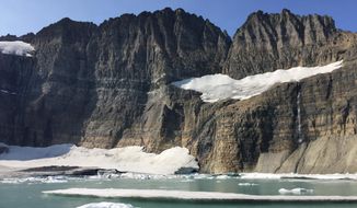 This Sept. 5, 2017 photo shows Grinnell Glacier at the turnaround point of an 11-mile round-trip hike in Glacier National Park in Montana. (AP Photo/Beth J. Harpaz)