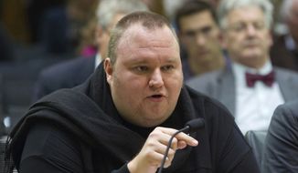 In this July 3, 2013, file photo, Internet entrepreneur Kim Dotcom speaks during the Intelligence and Security select committee hearing at Parliament in Wellington, New Zealand. Kim Dotcom and three of his former colleagues have lost their latest bid to avoid extradition to the U.S. to face criminal charges. New Zealand’s Court of Appeal on Thursday, July 5, 2018, upheld earlier court rulings that found the men were eligible to be handed over to U.S. authorities. (Mark Mitchell/New Zealand Herald via AP, File)