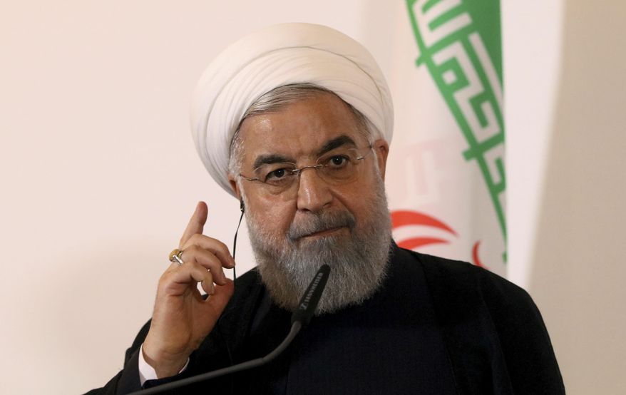 Iranian President Hassan Rouhani speaks during a joint news conference as part of a meeting with Austria's Chancellor Sebastian Kurz at the federal chancellery in Vienna, Austria, Wednesday, July 4, 2018. (AP Photo/Ronald Zak)