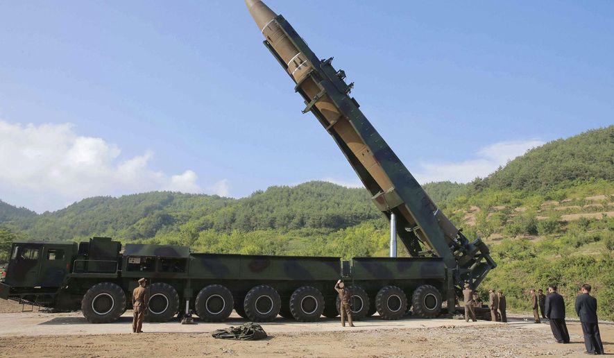 In this July 4, 2017, file photo distributed by the North Korean government, North Korean leader Kim Jong-un, second from right, inspects the preparation of the launch of a Hwasong-14 intercontinental ballistic missile (ICBM) in North Korea's northwest. Recent media reports citing intelligence assessments suggest North Korea is continuing to build and improve the infrastructure for its nuclear and missile programs. (Korean Central News Agency/Korea News Service via AP, File)