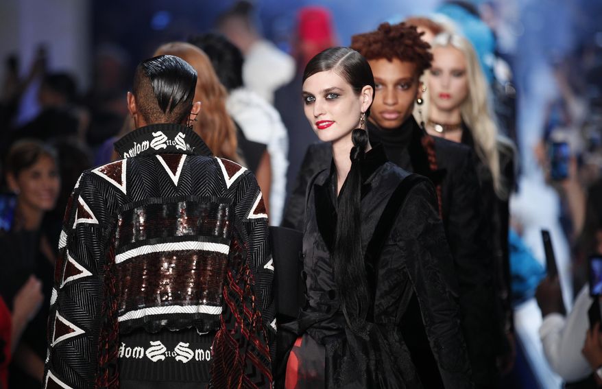 Models wear creations for Jean-Paul Gaultier Haute Couture Fall-Winter 2018/2019 fashion collection Wednesday, July 4, 2018 in Paris. (AP Photo/Francois Mori)