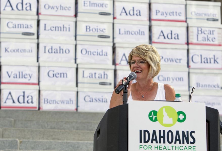 State lawmaker Rep. Christy Perry, R-Nampa, who has been an advocate of the Medicaid expansion initiative, speaks in Boise, Idaho, Friday, July 6, 2018, to a group of volunteers who gathered over 70,000 voter signatures to place the measure on this November's ballot. (Darin Oswald/Idaho Statesman via AP)