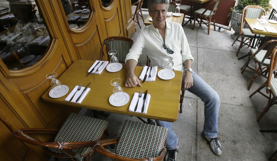 FILE- In this Aug. 8, 2007 file photo, Anthony Bourdain, host of theTravel Channel's "No Reservations," poses in a New York restaurant. Court papers show Bourdain was worth $1.2 million when he died in June 2018. Most of his estate was left to his 11-year-old daughter. (AP Photo/Mary Altaffer, File)