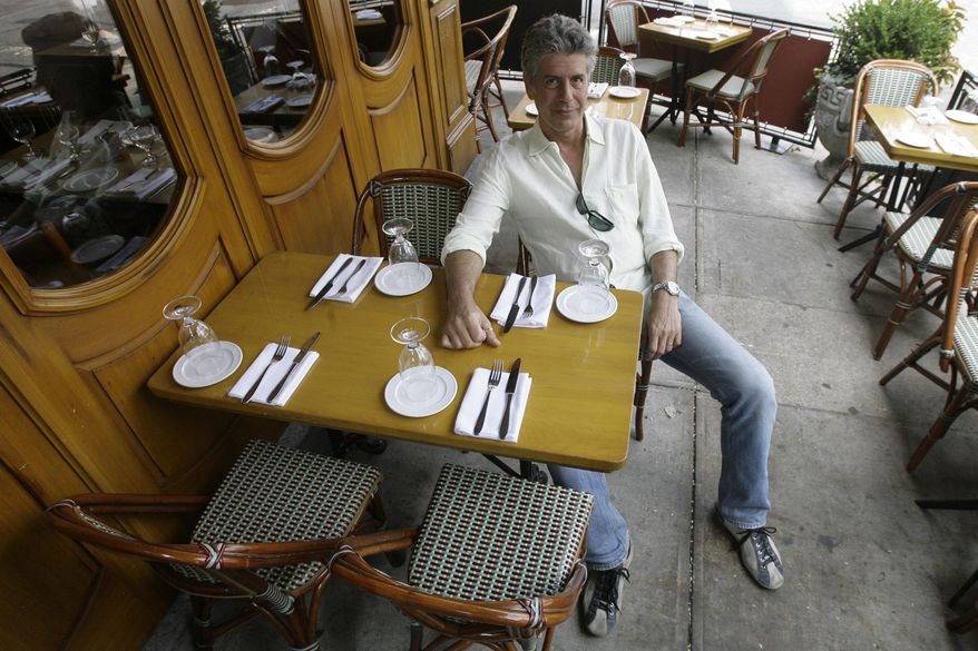 FILE- In this Aug. 8, 2007 file photo, Anthony Bourdain, host of theTravel Channel's "No Reservations," poses in a New York restaurant. Court papers show Bourdain was worth $1.2 million when he died in June 2018. Most of his estate was left to his 11-year-old daughter. (AP Photo/Mary Altaffer, File)