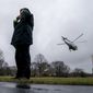 Secret Service agents stand on the South Lawn as Marine One with President Donald Trump aboard departs the White House in Washington, Friday, Feb. 23, 2018, to travel to Oxon Hill, Md. to speak at the Conservative Political Action Conference (CPAC). (AP Photo/Andrew Harnik)