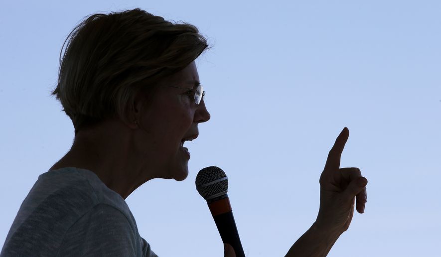 Sen. Elizabeth Warren, D-Mass., addresses an audience at Belkin Family Lookout Farm during a town hall event, Sunday, July 8, 2018, in Natick, Mass. Warren is hosting the town hall and cookout following an Independence Day trip to visit U.S. troops in Iraq and Kuwait. (AP Photo/Steven Senne)