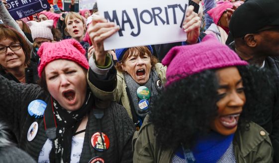 Protesters cheer at the Women&#39;s March on Washington during the first full day of Donald Trump&#39;s presidency, Saturday, Jan. 21, 2017, in Washington. (AP Photo/John Minchillo) ** FILE **