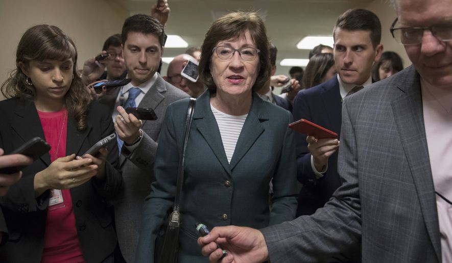 With reporters looking for updates, Sen. Susan Collins, R-Maine, and other senators rush to the chamber to vote on amendments as the Republican leadership works to craft their sweeping tax bill, on Capitol Hill in Washington, Thursday, Nov. 30, 2017. It would mark the first time in 31 years that Congress has overhauled the tax code, making it the biggest legislative achievement of President Donald Trump&#39;s first year in office. (AP Photo/J. Scott Applewhite)
