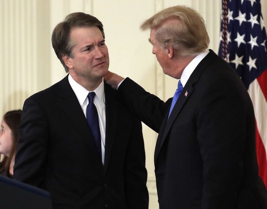 President Donald Trump greets  Judge Brett Kavanaugh his Supreme Court nominee, in the East Room of the White House, Monday, July 9, 2018, in Washington.  (AP Photo/Evan Vucci)