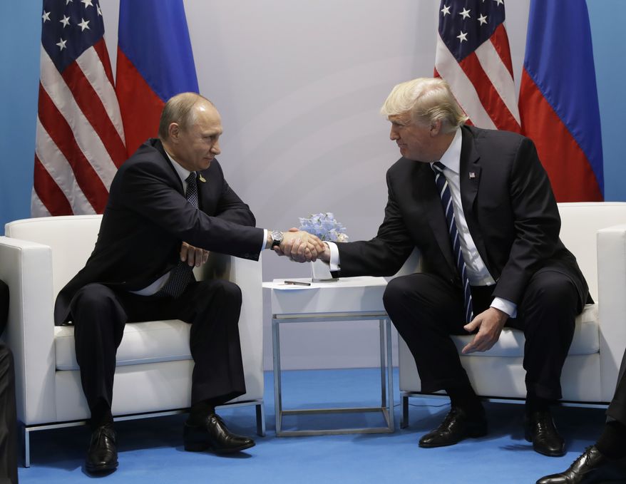 President Donald Trump shakes hands with Russian President Vladimir Putin at the G20 Summit, Friday, July 7, 2017, in Hamburg. (AP Photo/Evan Vucci)