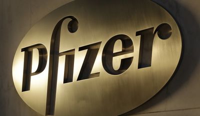FILE - This Monday, Nov. 23, 2015, file photo, shows the Pfizer logo on display at the company&#39;s world headquarters in New York. Pfizer Inc. (PFE) on Tuesday, Aug. 1, 2017, reported second-quarter profit of $3.07 billion. (AP Photo/Mark Lennihan, File)