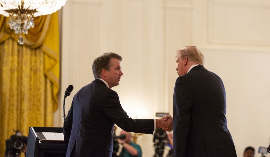 President Donald Trump shakes hands with Brett Kavanaugh, his Supreme Court nominee, in the East Room of the White House, Monday, July 9, 2018, in Washington. (AP Photo/Evan Vucci)