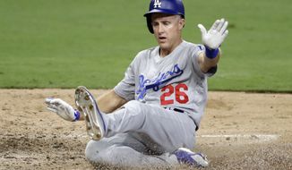 Los Angeles Dodgers&#39; Chase Utley scores from second off a single by Justin Turner during the eighth inning of a baseball game against the San Diego Padres, Monday, July 9, 2018, in San Diego. (AP Photo/Gregory Bull)