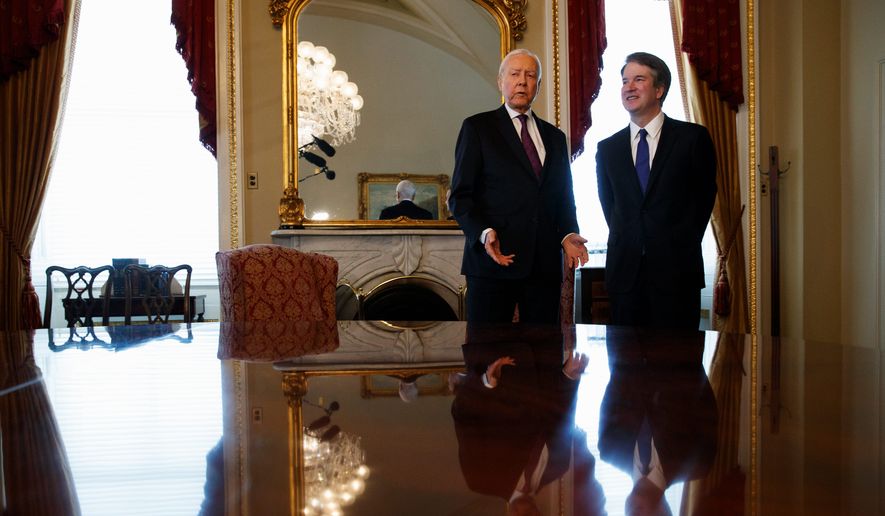 Supreme Court nominee Brett Kavanaugh (right) met Wednesday on Capitol Hill with Sen. Orrin G. Hatch, Utah Republican, who called him &quot;a very fine man.&quot; (Associated Press)