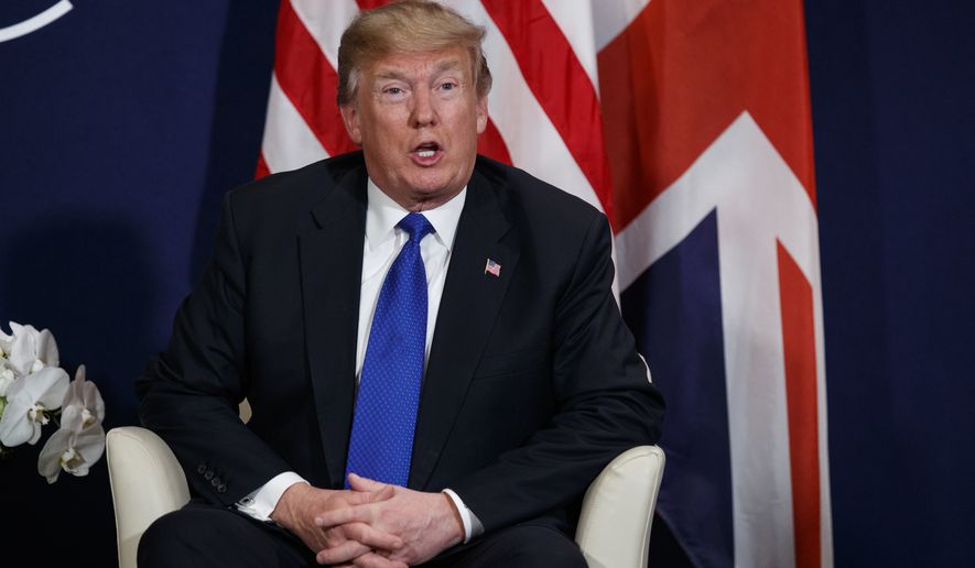 President Donald Trump speaks during a meeting with British Prime Minister Theresa May at the World Economic Forum, Thursday, Jan. 25, 2018, in Davos. (AP Photo/Evan Vucci)