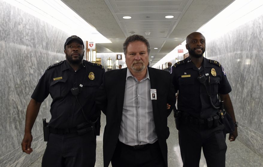 Don Rosenberg, father of Drew Rosenberg who was killed by an illegal immigrant is arrested after disrupting a Senate Judiciary hearing to examine the Administration's immigration enforcement policies, in Washington, Tuesday, July 21, 2015. (AP Photo/Molly Riley)