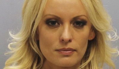 This photo provided by the Franklin County Sheriff&#39;s Office on Thursday, July 12, 2018, shows porn actress Stormy Daniels.  Daniels was arrested at a Columbus, Ohio strip club and is accused of letting patrons touch her in violation of a state law, her attorney said early Thursday. (Franklin County Sheriff&#39;s Office via AP)