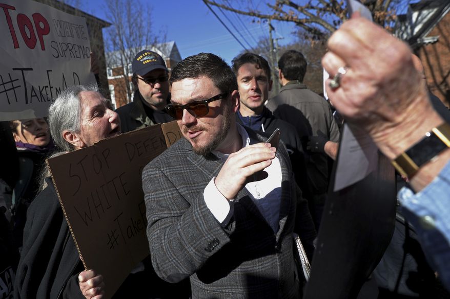 In this Feb. 27, 2018, file photo, Jason Kessler walks through a crowd of protesters in front of the Charlottesville Circuit Courthouse ahead of a decision regarding the covered Confederate statues, during a rally in Charlottesville, Va. (Zack Wajsgras/The Daily Progress via AP, File)