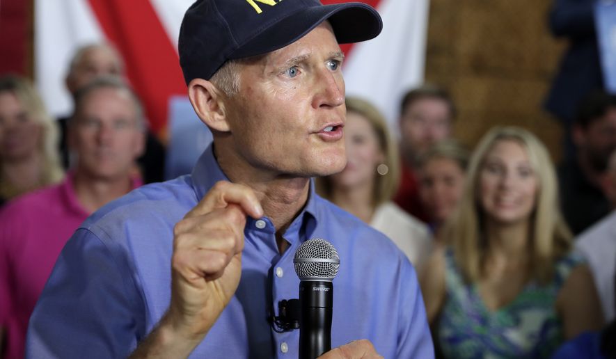 FILE - In this April 9, 2018, file photo, Florida Gov. Rick Scott announces his bid to run for the U.S. Senate at a news conference in Orlando, Fla. Scott has been a cheerleader for President Donald Trump but hasnt been as vocal with his support since deciding to run for the U.S. Senate. The two-term Republican governor has split with Trump on issues and wont even say if he thinks Trump is doing a good job. (AP Photo/John Raoux, File)