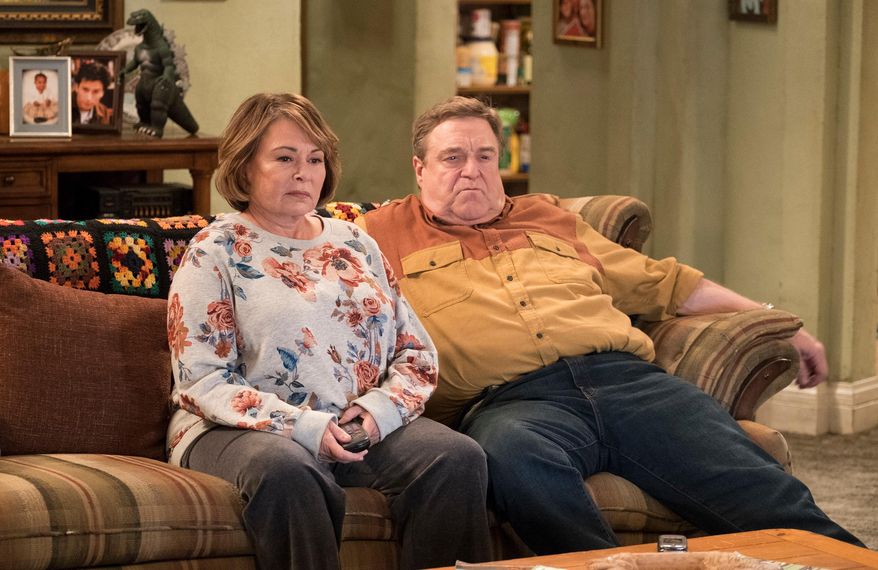 In this image released by ABC, Roseanne Barr, left, and John Goodman appear in a scene from the comedy series "Roseanne." "Roseanne," "Will & Grace," "Twin Peaks" and "American Idol" were among the reboots largely snubbed by the television academy on Thursday. (Adam Rose/ABC via AP)