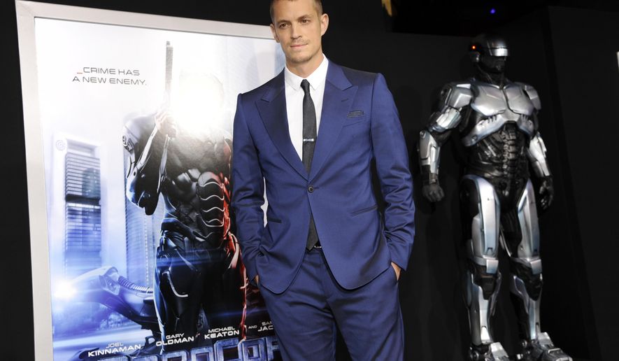 FILE - In this Feb. 10, 2014 file photo, actor Joel Kinnaman appears at the premiere of "Robocop" in Los Angeles. MGM is developing the sequel “RoboCop Returns” with “District 9” and “Elysium” filmmaker Neill Blomkamp to direct. The film will be a sequel to Paul Verhoeven’s 1987 original about a cyborg police officer in a crime-ridden Detroit. (Photo by Chris Pizzello/Invision/AP, File)