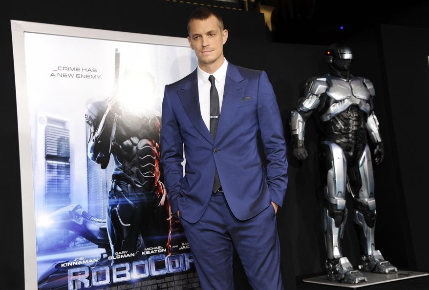 FILE - In this Feb. 10, 2014 file photo, actor Joel Kinnaman appears at the premiere of "Robocop" in Los Angeles. MGM is developing the sequel “RoboCop Returns” with “District 9” and “Elysium” filmmaker Neill Blomkamp to direct. The film will be a sequel to Paul Verhoeven’s 1987 original about a cyborg police officer in a crime-ridden Detroit. (Photo by Chris Pizzello/Invision/AP, File)
