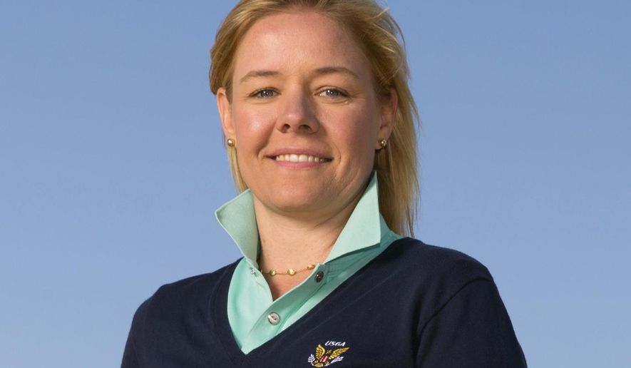 This June 20, 2015, photo provided by the USGA shows Sarah Hirshland during the third round of the 2015 U.S. Open golf tournament at Chambers Bay in University Place, Wash. The U.S. Olympic Committee has hired Sarah Hirshland as its CEO, placing the executive at the U.S. Golf Association in charge of stabilizing an organization that has been hammered by sex-abuse scandals spanning several Olympic sports. (Darren Carroll/USGA via AP)