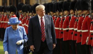 U.S. President Donald Trump and Britain&#39;s Queen Elizabeth II inspect a Guard of Honour, formed of the Coldstream Guards at Windsor Castle in Windsor, England, Friday, July 13, 2018.(AP Photo/Matt Dunham, Pool)