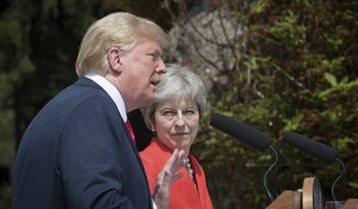 British Prime Minister Theresa May and U.S President Donald Trump hold a joint press conference at Chequers, in Buckinghamshire, England, Friday, July 13, 2018. (Stefan Rousseau/Pool Photo via AP)