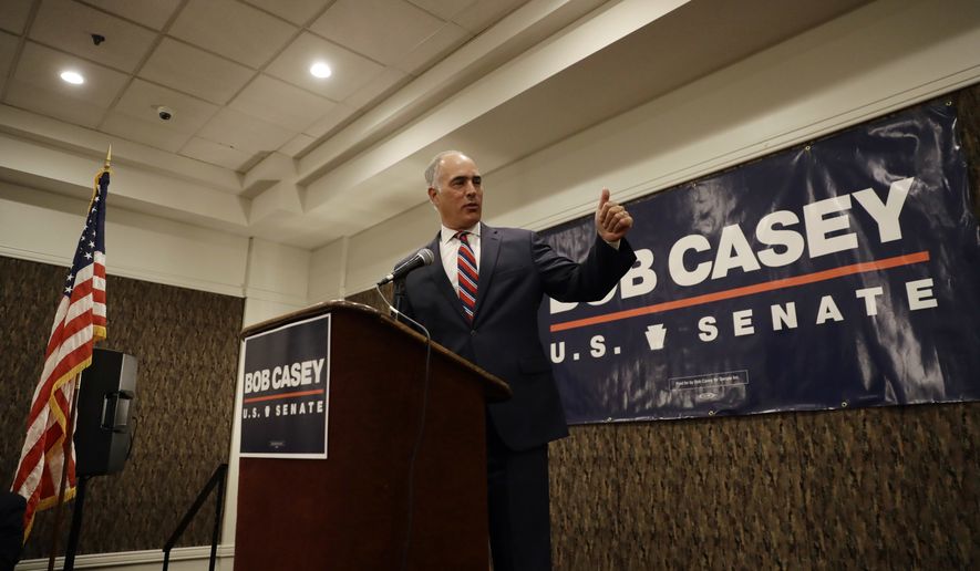 Sen. Bob Casey, D-Pa., gestures after being introduced before a general election campaign event with Sen. Kamala Harris, D-Calif., Friday, July 13, 2018, in Philadelphia. Harris is headlining a pair of fundraisers for Casey. (AP Photo/Matt Slocum)