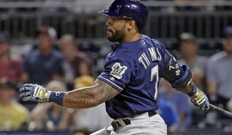 Milwaukee Brewers&#39; Eric Thames watches his RBI single off Pittsburgh Pirates reliever Michael Feliz during the ninth inning of a baseball game in Pittsburgh, Thursday, July 12, 2018. The Pirates won 6-3. (AP Photo/Gene J. Puskar)