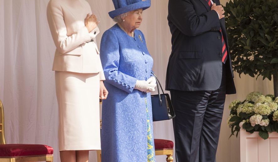 Britain's Queen Elizabeth II, centre stands with US President Donald Trump and first lady Melania on the dias in the Quadrangle as they listen to the US national anthem, during a ceremonial welcome at Windsor Castle, Friday, July 13, 2018 in Windsor, England. The monarch welcomed the American president in the courtyard of the royal castle. (Richard Pohle/Pool Photo via AP)