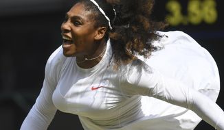 Serena Williams of the US serves to Julia Goerges of Germany during their women&#39;s semifinal match at the Wimbledon Tennis Championships in London, Thursday July 12, 2018. (Neil Hall/Pool via AP)