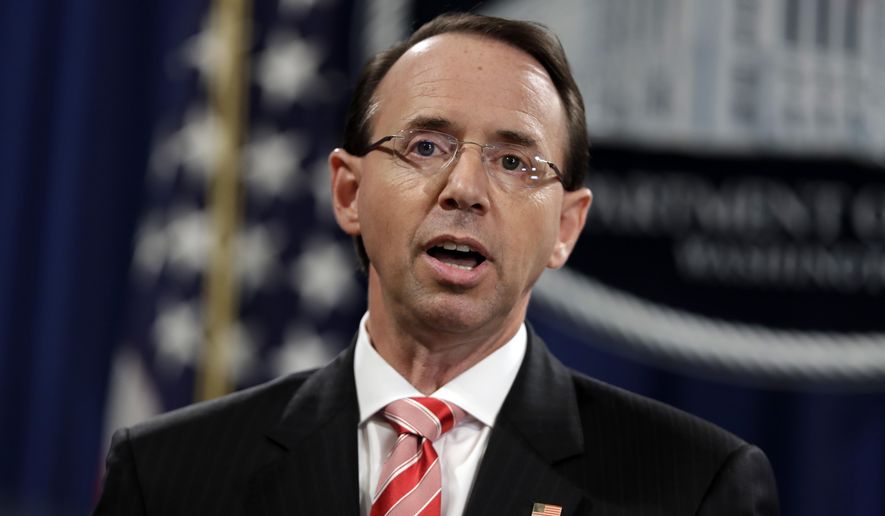 Deputy Attorney General Rod Rosenstein speaks during a news conference at the Department of Justice, Friday, July 13, 2018, in Washington. (AP Photo/Evan Vucci)