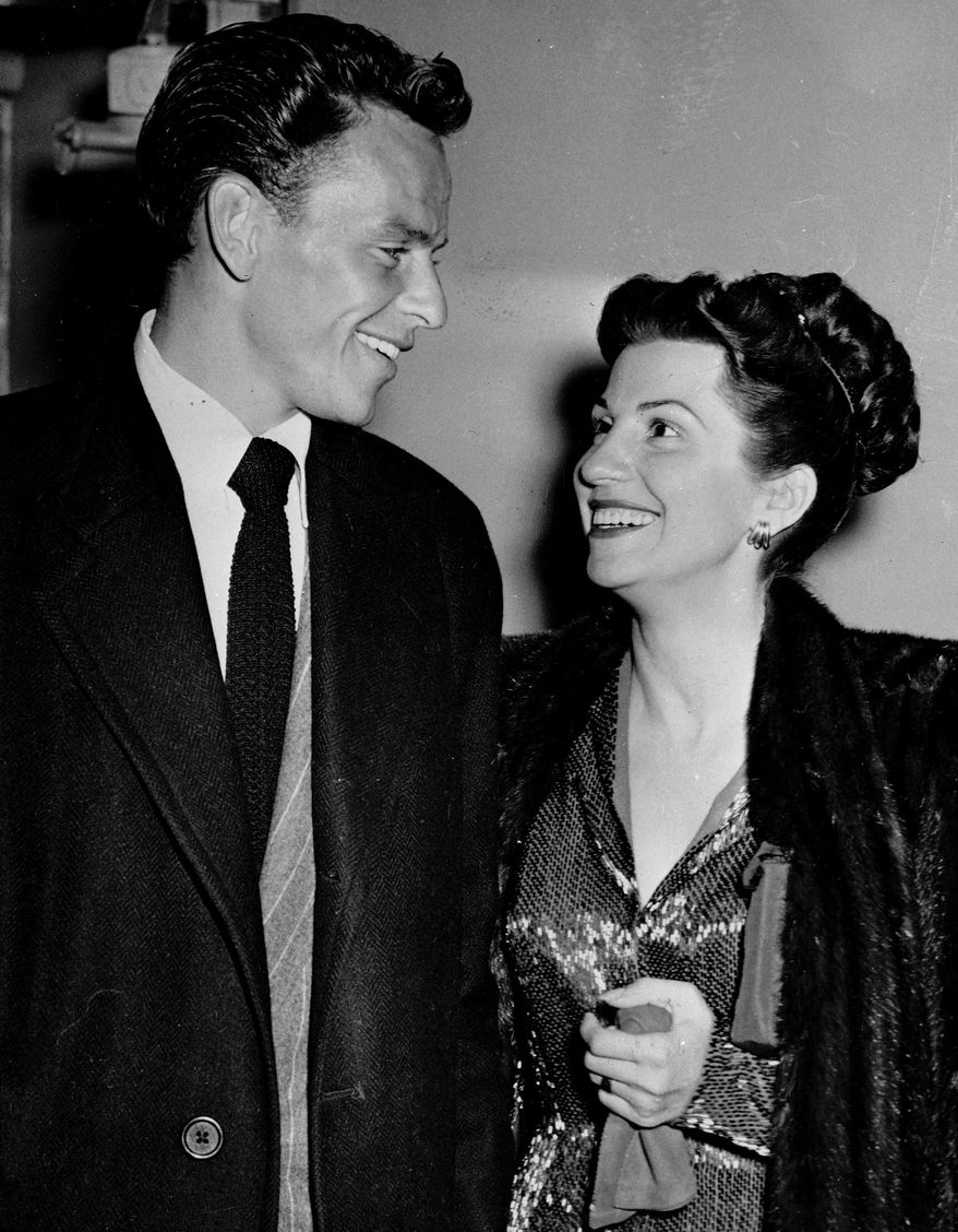 FILE - In this Oct. 23, 1946 file photo, singer Frank Sinatra and his wife Nancy smile broadly as they leave a Hollywood night club following a surprise meeting. Nancy Sinatra Sr., the childhood sweetheart of Frank Sinatra who became the first of his four wives and the mother of his three children, has died. She was 101. Her daughter, Nancy Sinatra Jr., tweeted that her mother died Friday, July 13, 2018. (AP Photo/File)