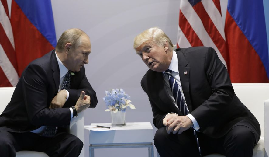 FILE - In this July 7, 2017, file photo, President Donald Trump meets with Russian President Vladimir Putin at the G20 Summit in Hamburg. Trump seems of two minds about nuclear weapons. He has mused about their elimination. But he also has called for a U.S. buildup and bragged about his nuclear "button." How these seemingly competing instincts will play out in his Helsinki talks with Putin on July 16, 2018,  could profoundly affect the direction of U.S. defense policy. (AP Photo/Evan Vucci, File)