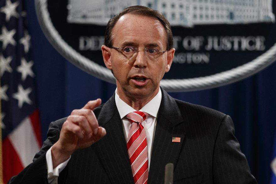 Deputy Attorney General Rod Rosenstein speaks during a news conference at the Department of Justice, Friday, July 13, 2018, in Washington. (AP Photo/Evan Vucci)