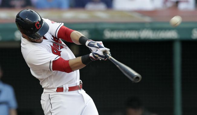 Cleveland Indians&#x27; Yan Gomes hits an RBI double off New York Yankees starting pitcher Domingo German during the second inning of a baseball game Friday, July 13, 2018, in Cleveland. (AP Photo/Tony Dejak)
