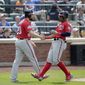 Washington Nationals&#39; Daniel Murphy, left and Wilmer Difo celebrate after scoring on a single hit by Trea Turner during the seventh inning of the baseball game against the New York Mets at Citi Field, Sunday, July 15, 2018, in New York. (AP Photo/Seth Wenig)
