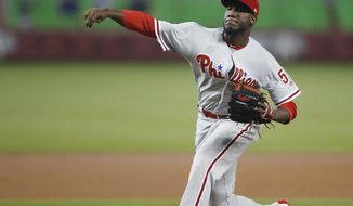 Philadelphia Phillies starting pitcher Enyel De Los Santos delivers during the first inning of a baseball game against the Miami Marlins, Sunday, July 15, 2018, in Miami. (AP Photo/Brynn Anderson)