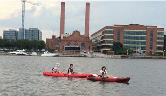 The Anacostia Riverkeepers takes kayakers out for a tour by the Yards Park Marina. This year, the nonprofit group is hoping to start sharing water quality data in a new app to explore the idea of taking swimmers into the river. (Anacostia RiverKeepers)
