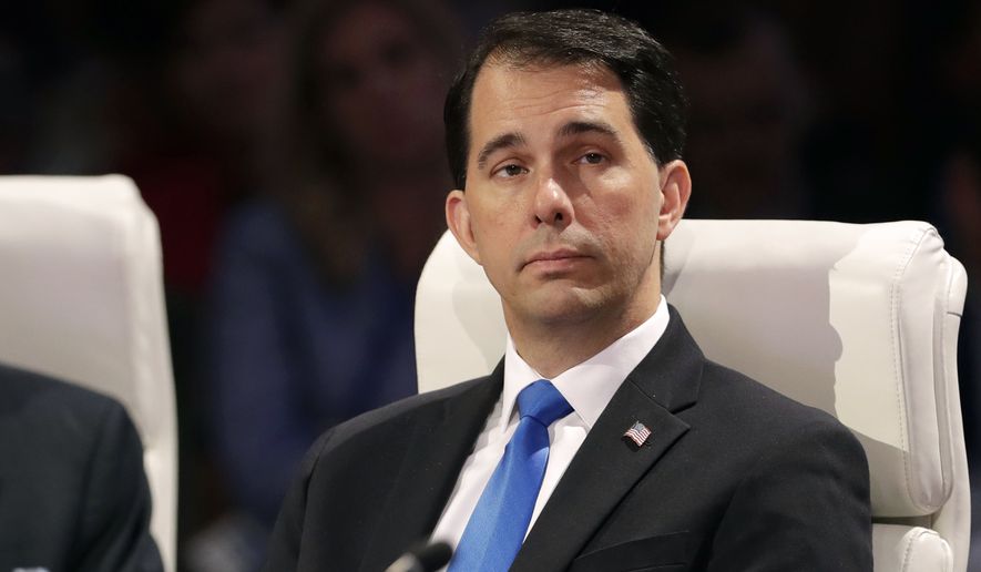 FILE - In this July 15, 2016, file photo, Wisconsin Gov. Scott Walker listens to a speaker at the National Governors Association meeting in Des Moines, Iowa. Walker said Monday, July 18, 2016, that he won&#39;t run for president again as a sitting governor and that he intends to use his prime-time speech at the Republican National Convention this week to argue that America deserves better than Hillary Clinton. (AP Photo/Charlie Neibergall, File)