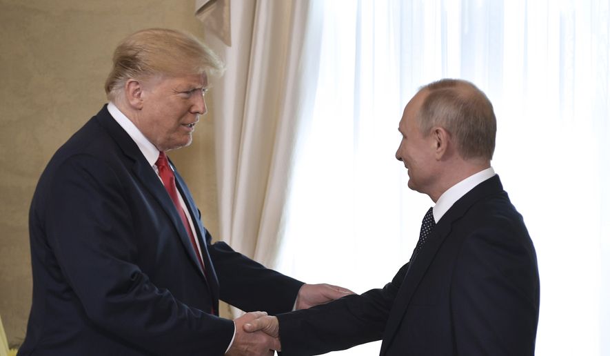 U.S. President Donald Trump and Russian President Vladimir Putin, right, welcome each other at the Presidential Palace in Helsinki, Finland, Monday, July 16, 2018 prior to Trump's and Putin's one-on-one meeting in the Finnish capital. (Alexei Nikolsky, Sputnik, Kremlin Pool Photo via AP)