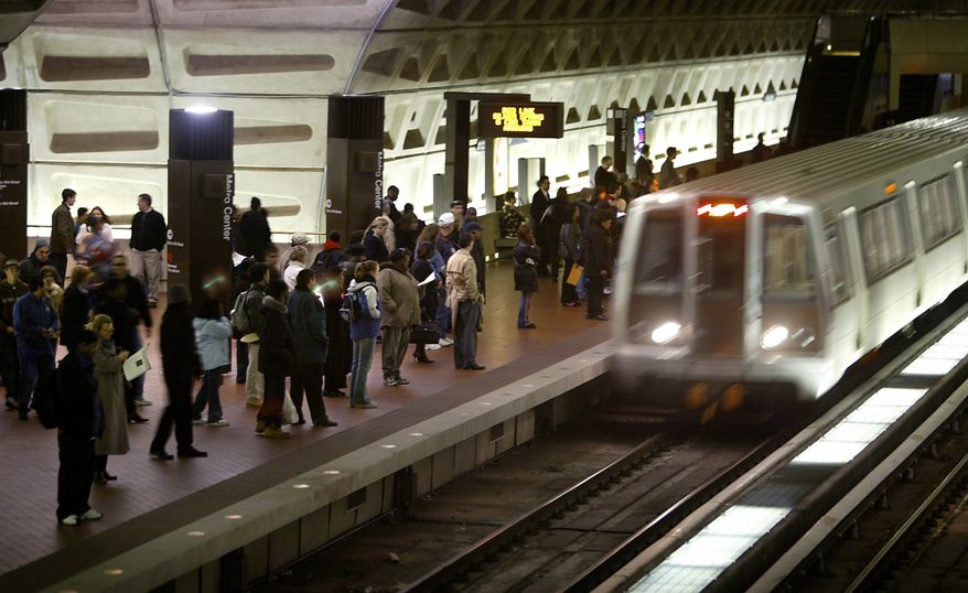 In a Monday, April 5, 2004, file photo, riders wait to board an arriving train at the D.C. Metro Center, in Washington. (AP Photo/Lawrence Jackson, File) **FILE**