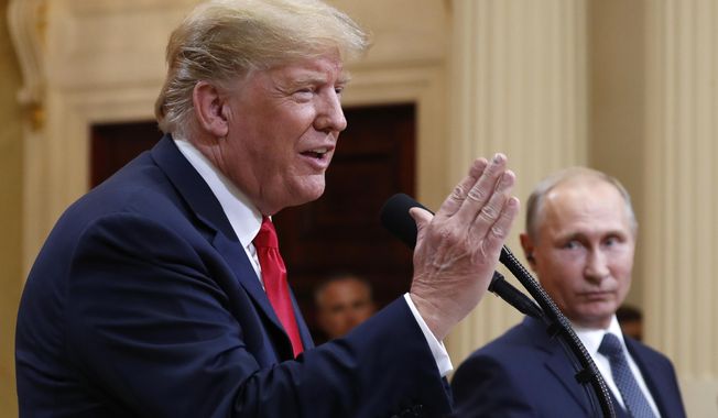 U.S. President Donald Trump speaks with Russian President Vladimir Putin during a press conference after their meeting at the Presidential Palace in Helsinki, Finland, Monday, July 16, 2018. (AP Photo/Pablo Martinez Monsivais)