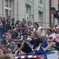 Croatia&#39;s national soccer team members are seen on top of an open bus as they are greeted by fans during a celebration in central Zagreb, Croatia, Monday, July 16, 2018. In an outburst of national pride and joy, Croatia rolled out a red carpet and staged a euphoric heroes&#39; welcome for the national team on Monday despite its loss to France in the World Cup final. (AP Photo/Marko Drobnjakovic)