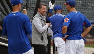 FILE - In this June 27, 2018, file photo, New York Mets chief operating officer Jeff Wilpon, center, talks with Michael Conforto and No. 1 draft pick Jerred Kelenic, left, before the team&#39;s baseball game against the Pittsburgh Pirates in New York. Wilpon won’t need Jacob deGrom or Noah Syndergaard to bring a championship to New York this year. Though Wilpon is hardly a hardcore gamer, he and his family are showing a magic touch in the world of esports. The Wilpon-owned New York Excelsior have been a juggernaut during the inaugural season of the Overwatch League, and the Wilpons are being praised for their leadership of the video game club. (AP Photo/Julie Jacobson, File)