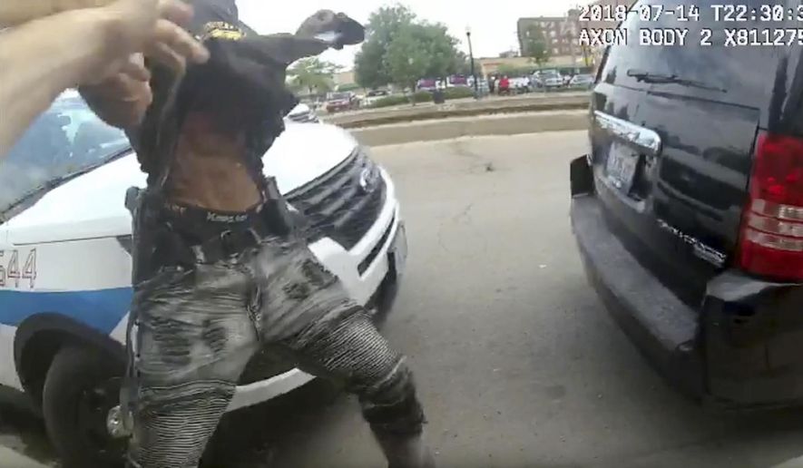 This frame grab from police body cam video provided by the Chicago Police Department shows authorities trying to apprehend a suspect who appeared to be armed, Saturday, July 14, 2018, in Chicago. The suspect was fatally shot by police during the confrontation. (Chicago Police Department via AP)